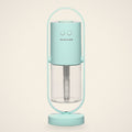 Light Blue mini USB humidifier in its oval stand with a clear water tank, front view