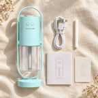 Light blue mini USB humidifier with USB cable, cotton wick, instruction manual and card