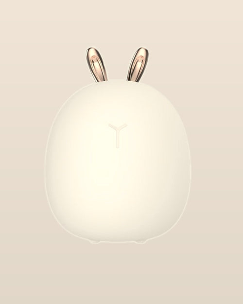 Front view of the white Mistglow bunny night light with rose-gold-tone ears